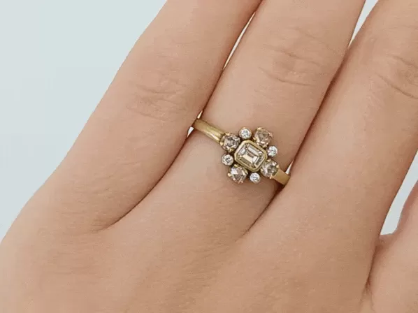 Gold, Emerald Cut Diamond, & Diamond Halo Holbein Ring