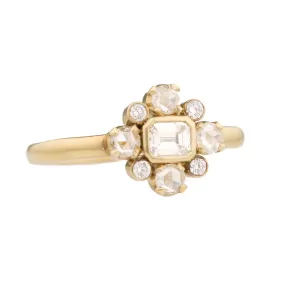 Gold, Emerald Cut Diamond, & Diamond Halo Holbein Ring